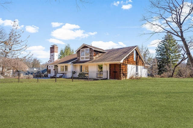 exterior space with a yard, fence private yard, and a chimney