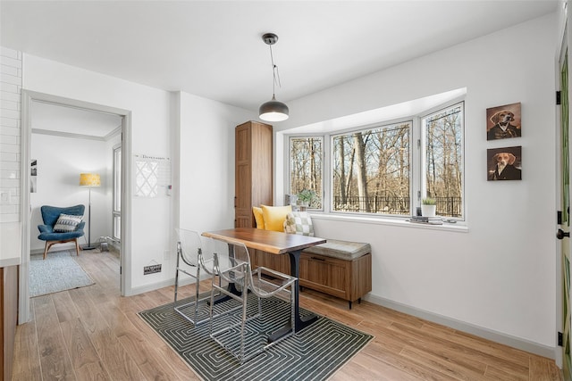 office featuring light wood-style flooring and baseboards