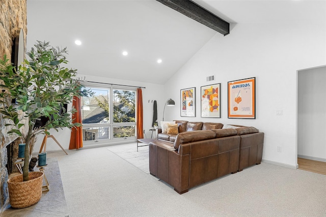 living area featuring beam ceiling, visible vents, carpet floors, and high vaulted ceiling