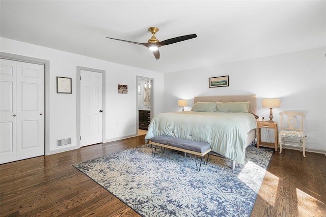 bedroom with ceiling fan, wood finished floors, visible vents, and baseboards