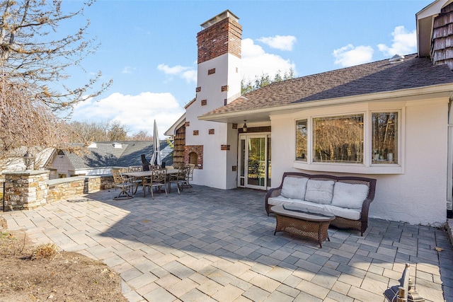 view of patio / terrace featuring outdoor dining space and an outdoor hangout area