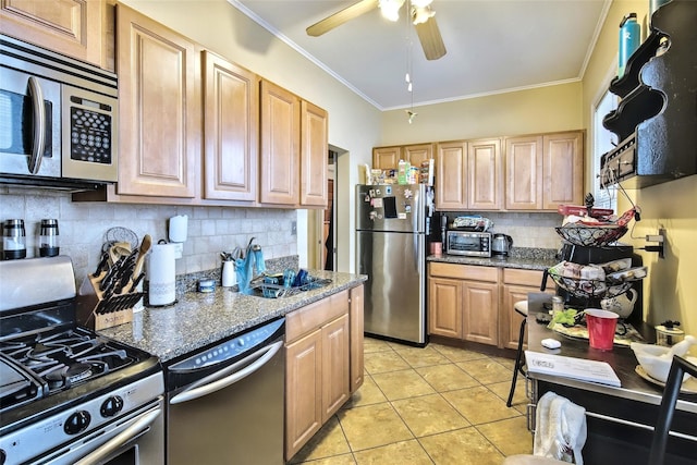 kitchen featuring light tile patterned floors, stainless steel appliances, crown molding, stone counters, and backsplash