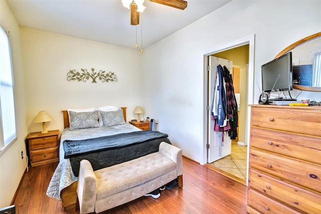 bedroom featuring ceiling fan and light wood-type flooring