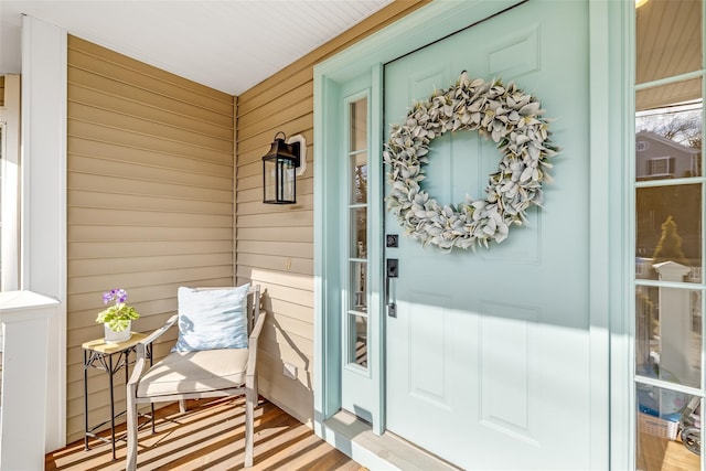 property entrance featuring a porch