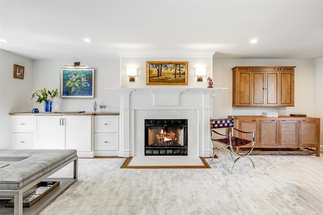 living room featuring wood finished floors, a fireplace with flush hearth, and recessed lighting