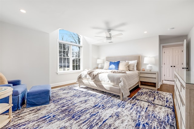 bedroom with ceiling fan, baseboards, wood finished floors, and recessed lighting