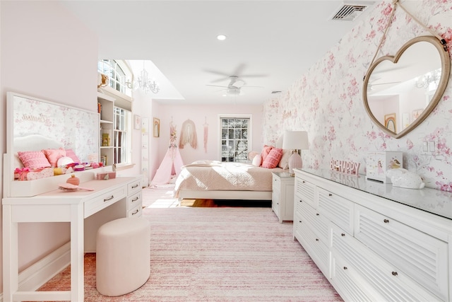 bedroom with a ceiling fan, visible vents, and wallpapered walls