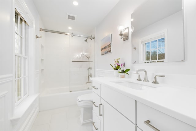 full bathroom featuring bathtub / shower combination, toilet, visible vents, vanity, and tile patterned floors