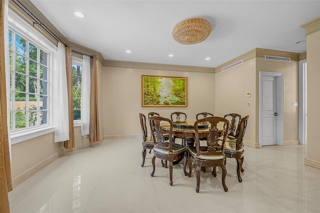 dining room with ornamental molding, recessed lighting, a healthy amount of sunlight, and baseboards