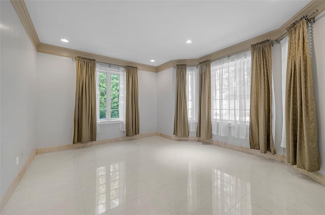 tiled empty room featuring baseboards, recessed lighting, and crown molding