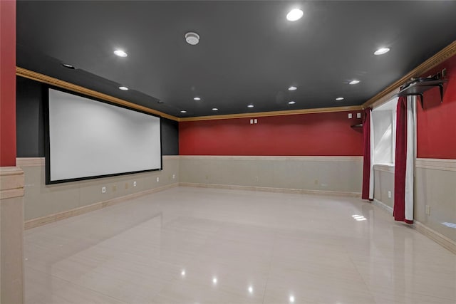 home theater room featuring ornamental molding, recessed lighting, a wainscoted wall, and light tile patterned flooring