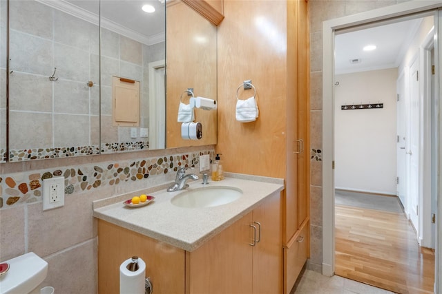 bathroom with crown molding and vanity