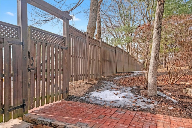 view of yard with fence and a gate