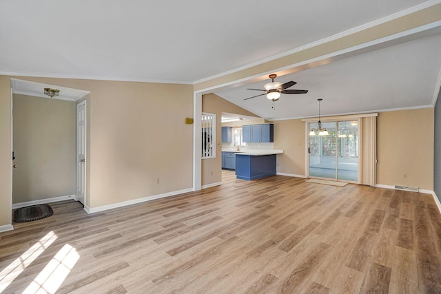 unfurnished living room featuring light wood-style floors, lofted ceiling, crown molding, and baseboards