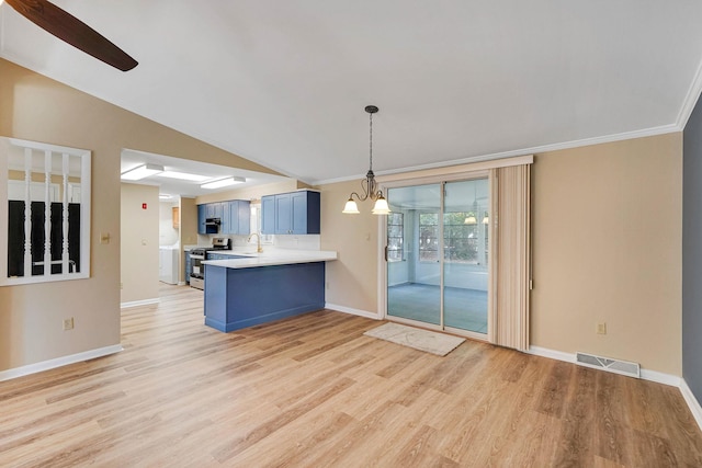 kitchen featuring visible vents, stainless steel range, a peninsula, light countertops, and blue cabinetry