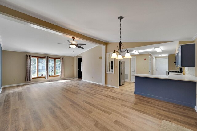 unfurnished living room with baseboards, vaulted ceiling with beams, a sink, and light wood finished floors