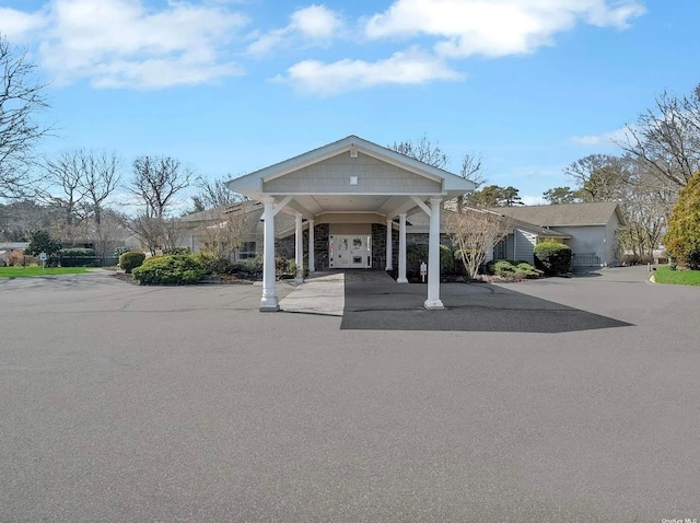 view of front of property featuring a carport