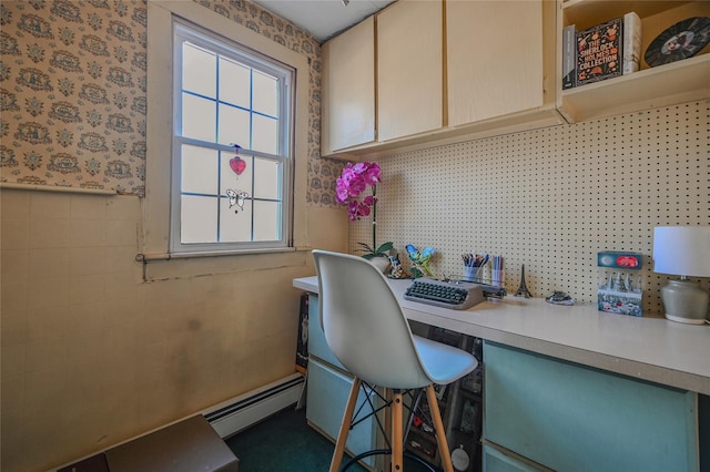 office area with a baseboard heating unit, a wainscoted wall, tile walls, and wallpapered walls