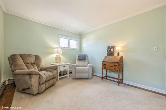 living area with ornamental molding, baseboard heating, carpet flooring, and baseboards