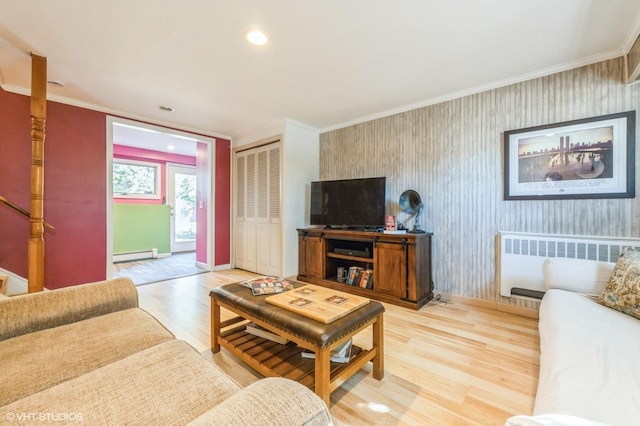 living room with crown molding, wallpapered walls, baseboard heating, radiator heating unit, and stairs