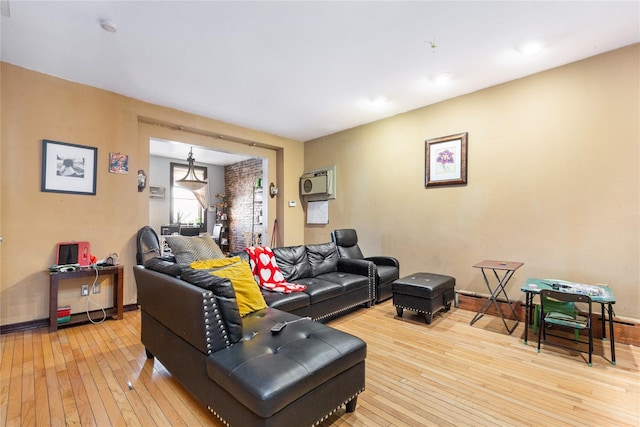 living room with light wood finished floors and baseboards