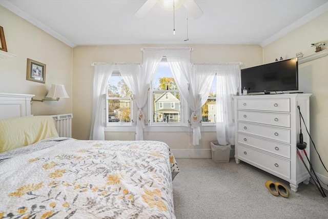 carpeted bedroom featuring a ceiling fan and baseboards