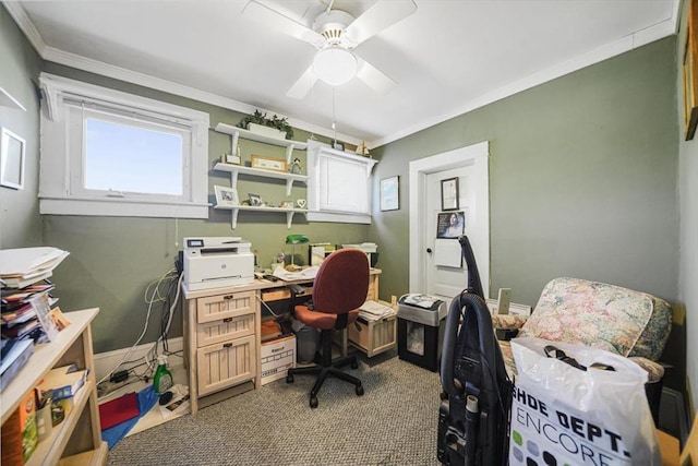 carpeted home office featuring ceiling fan, baseboards, and crown molding