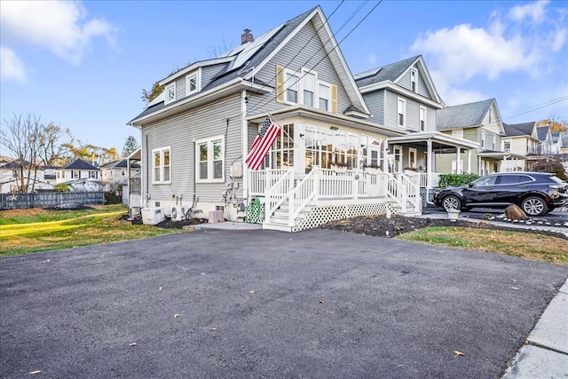 view of front of house featuring a porch and a residential view