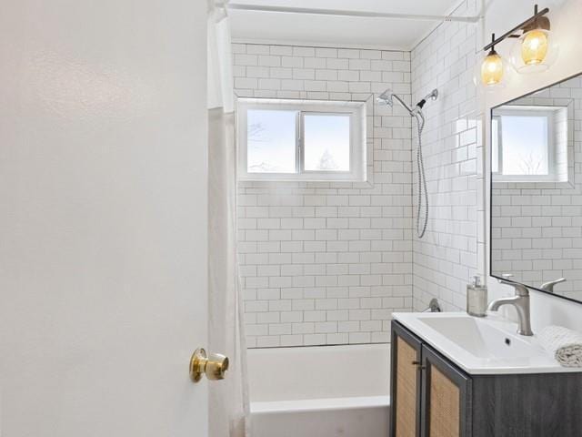 full bath featuring a healthy amount of sunlight, vanity, and shower / bathtub combination with curtain