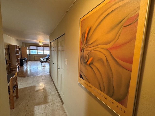 hallway featuring light tile patterned floors