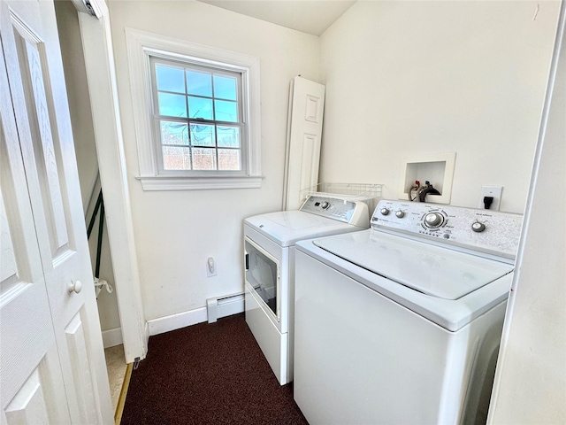 washroom featuring laundry area, baseboards, carpet floors, a baseboard heating unit, and separate washer and dryer