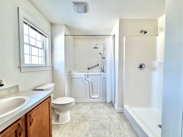 full bath with a shower with curtain, visible vents, vanity, and toilet