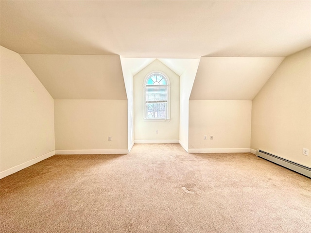 bonus room with baseboard heating, baseboards, vaulted ceiling, and light colored carpet