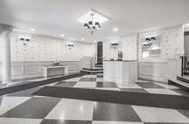 kitchen with a wainscoted wall, white cabinets, wallpapered walls, and recessed lighting