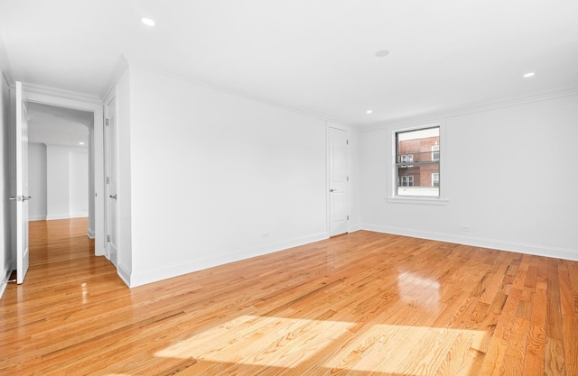 spare room featuring baseboards, recessed lighting, and light wood-style floors