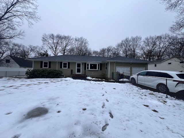 single story home featuring an attached garage