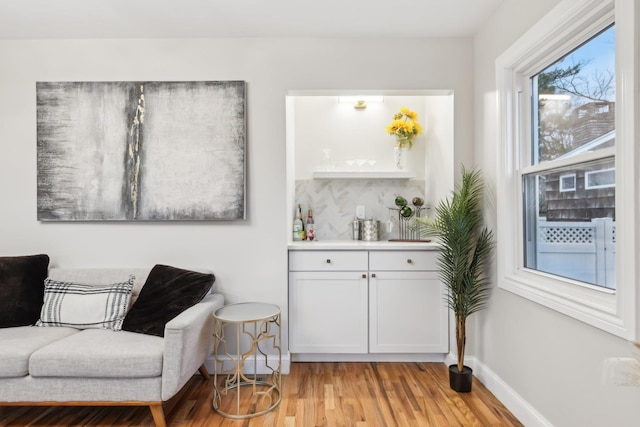 sitting room featuring light wood-style floors and baseboards