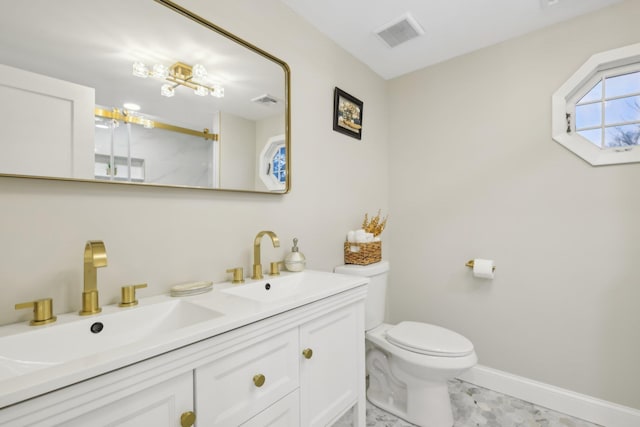 bathroom with toilet, an enclosed shower, a sink, and visible vents