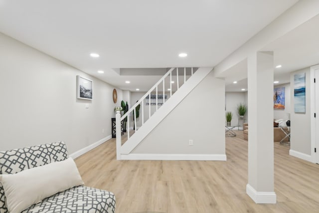 interior space with stairway, wood finished floors, and recessed lighting