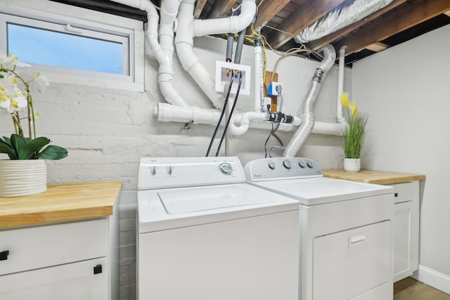 laundry area with cabinet space and washer and dryer