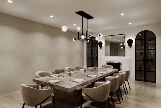 dining area featuring light wood-style flooring and recessed lighting