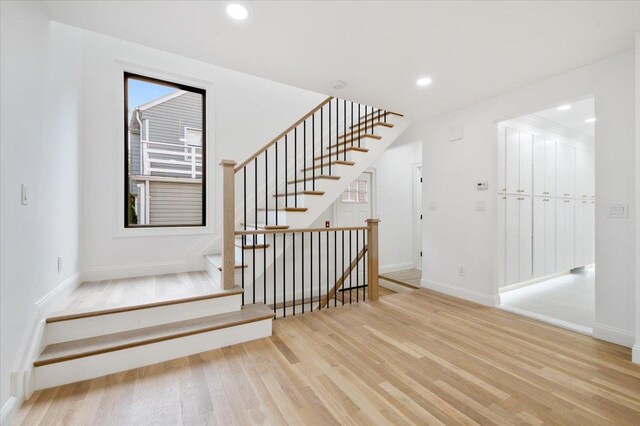 670 Emerson St, Woodmere, NY 11598 - stairway featuring wood finished floors and recessed lighting