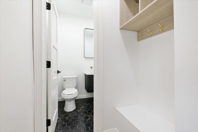 670 Emerson St, Woodmere, NY 11598 - bathroom featuring toilet and baseboards