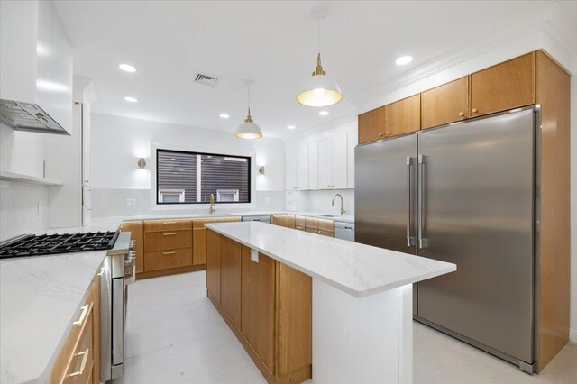 670 Emerson St, Woodmere, NY 11598 - kitchen featuring premium appliances, premium range hood, open shelves, hanging light fixtures, and a center island