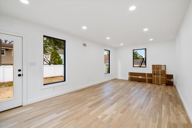 670 Emerson St, Woodmere, NY 11598 - empty room with light wood-type flooring and recessed lighting