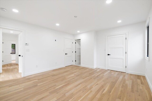 670 Emerson St, Woodmere, NY 11598 - spare room with light wood-type flooring and recessed lighting
