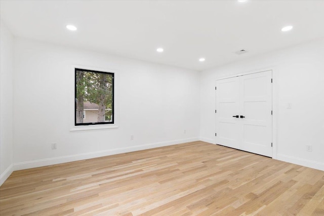 670 Emerson St, Woodmere, NY 11598 - spare room with light wood finished floors and recessed lighting