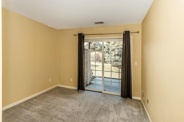 unfurnished room with light carpet, baseboards, and visible vents