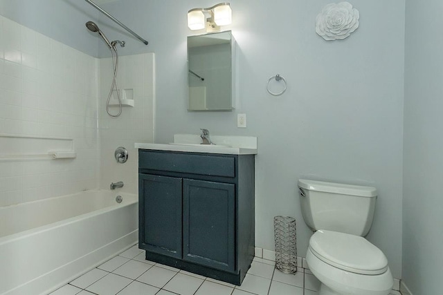 full bath featuring bathing tub / shower combination, toilet, vanity, tile patterned flooring, and baseboards