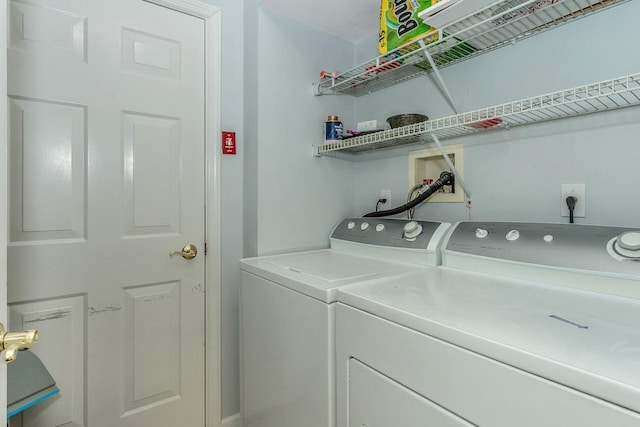 laundry area featuring laundry area and washing machine and clothes dryer